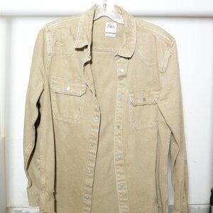 Distressed beige denim jacket